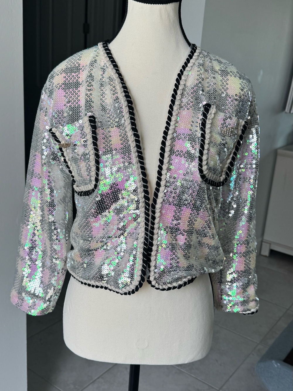lola Iridescent Sequin Cropped Jacket with Black Trim girl.